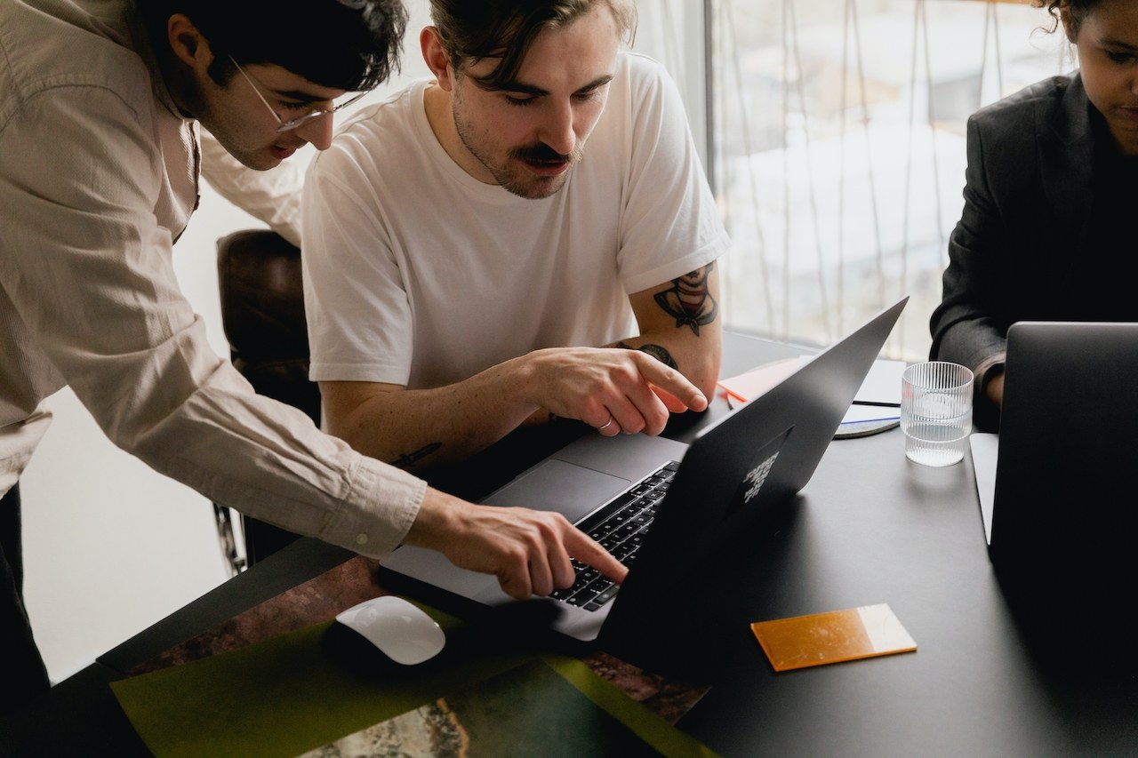 two persons at one computer